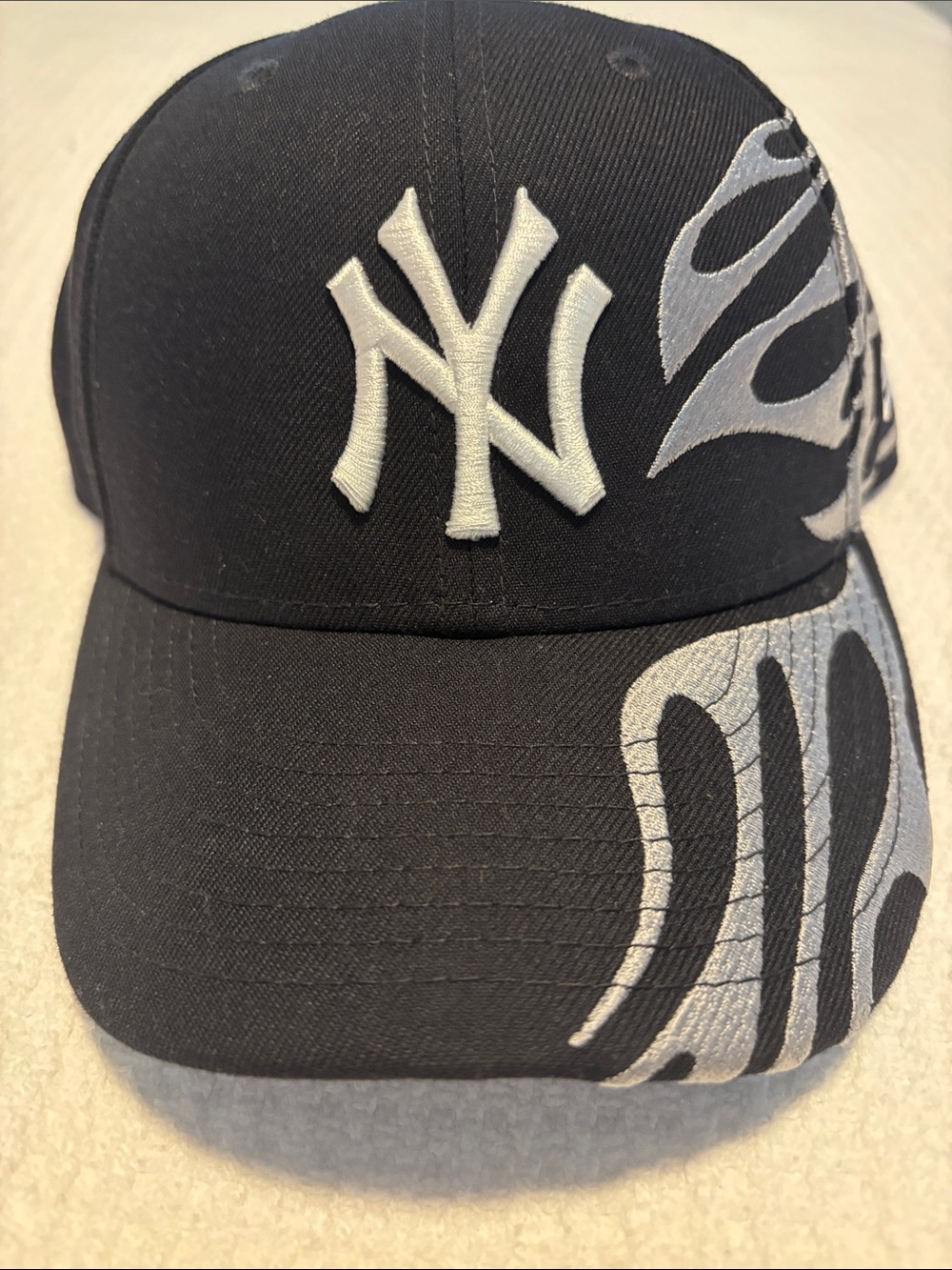 New Era Black Cap with White NY Logo and Silver Flame Accents